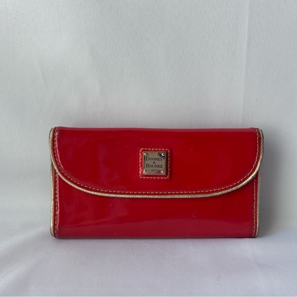 Dooney & Bourke Handbags - Dooney & Bourke patent continental Leather cluth with gold accents